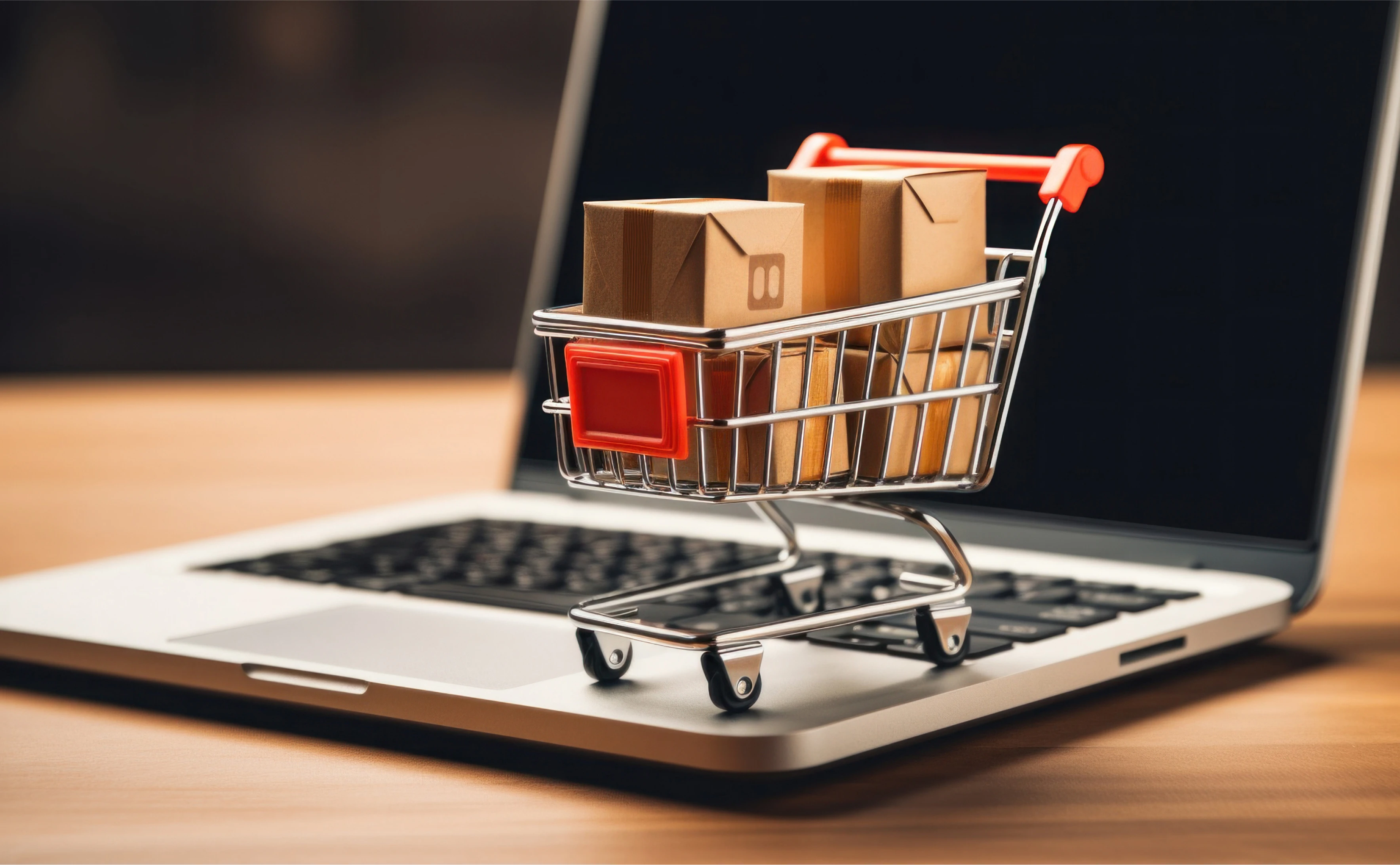 Packages in a shopping cart on a laptop